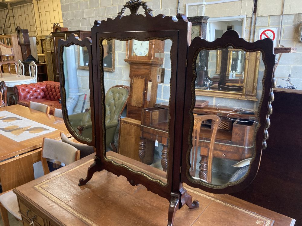 A mahogany and parcel-gilt triple toilet mirror, width 126cm, height 104cm